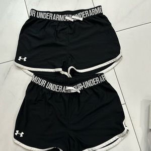 2 pairs of Under Armour black athletic shorts, size youth xl